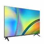 Colorful flat-screen TV on a two-leg stand, viewed at an angle.